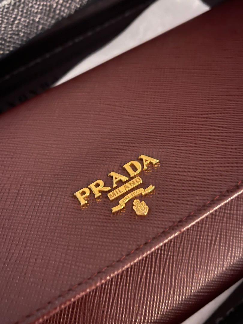 Prada Wallet Chain Bag (Category: Luxury) located in Toronto. Submitted by sn.closetsale (Listing ID 1138954999, Image 3). Description: Prada Vitello in burgundy leather. In very good condition, like new. Bought from Prada store in Hong Kong. • Gold-Tone Hardware Chain-Link Shoulder Strap Canvas Lining & Three Interior Pockets with Card Slots Snap Closure at Front • Price negotiable. .