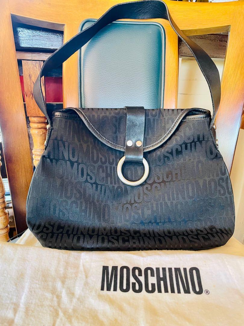Moschino Mono Shoulder Bag (Category: Luxury Bags & Wallets) located in Muntinlupa City. Submitted by phbudgetluxuryfinds (Listing ID 1138990258, Image 1). Description: With Original dustbag Excellent Condition - still feels new Authentic✅✅✅ Texture is comparable to Fendi Zucca.