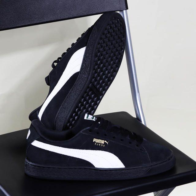 black white puma trainers