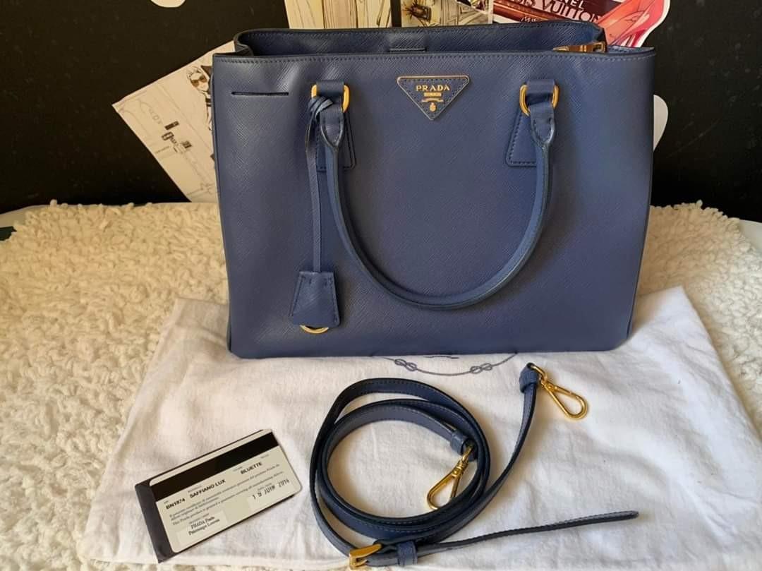 Auth medium saffiano lux (Category: Luxury Bags & Wallets) located in Bauang. Submitted by rjae07 (Listing ID 1139371864, Image 1). Description: ▪️Prada Medium Saffiano Lux Bag▪️ ☑️Available in Bacolod ✅Condition: 8.5/10 ✅Material: saffiano leather ✅Inclusions: dustbag, long strap and cards.