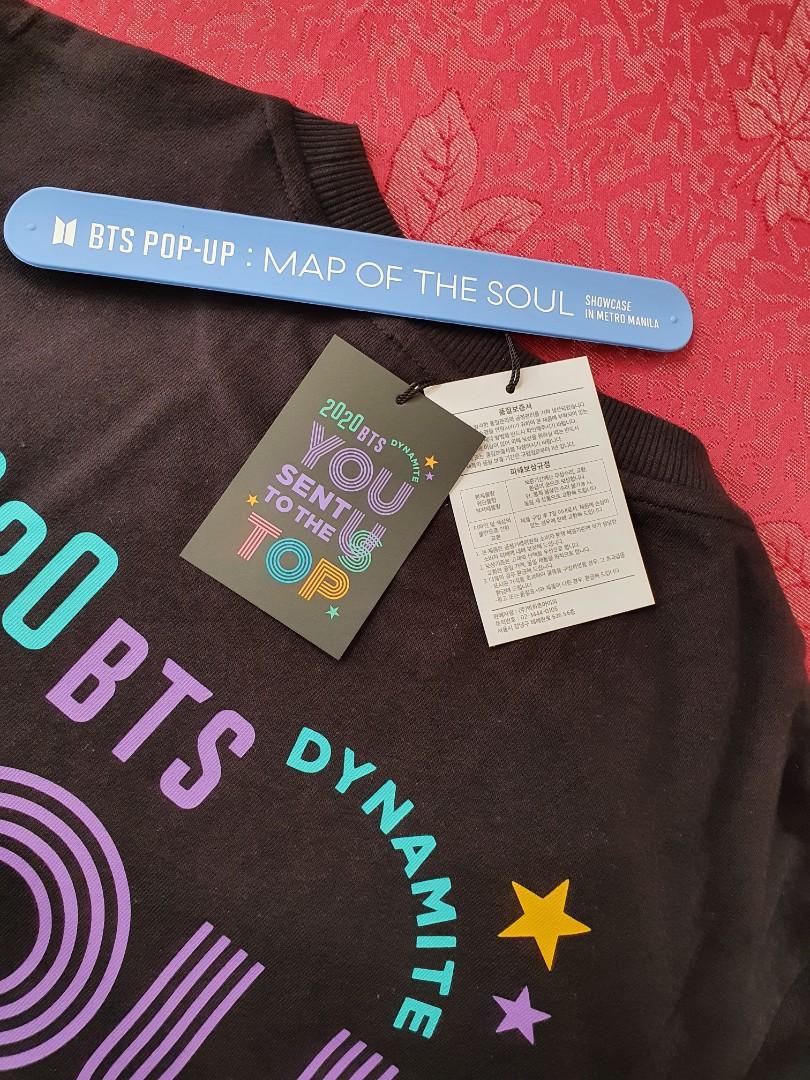 BTS On Top Dynamite Celebration Shirt (Official) (Category: Tshirts & Polo Shirts ) located in Manila. Submitted by boramartph (Listing ID 1139197861, Image 3). Description: Official from BTS Pop Up Store Metro Manila (Bought last July 2021) Size: Medium Used only once or twice Original Price was at P2,200 RFS: Size is a bit too big for me :( Original Plastic included **Pop Up Store Band & Idol Tote Bag not included**.