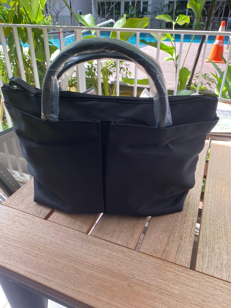 Multi Function Bag (Category: Tote Bags) located in Singapore. Submitted by leotina (Listing ID 1139210677, Image 1). Description: Brand new! Bought from lazada. 13.5 Inch.