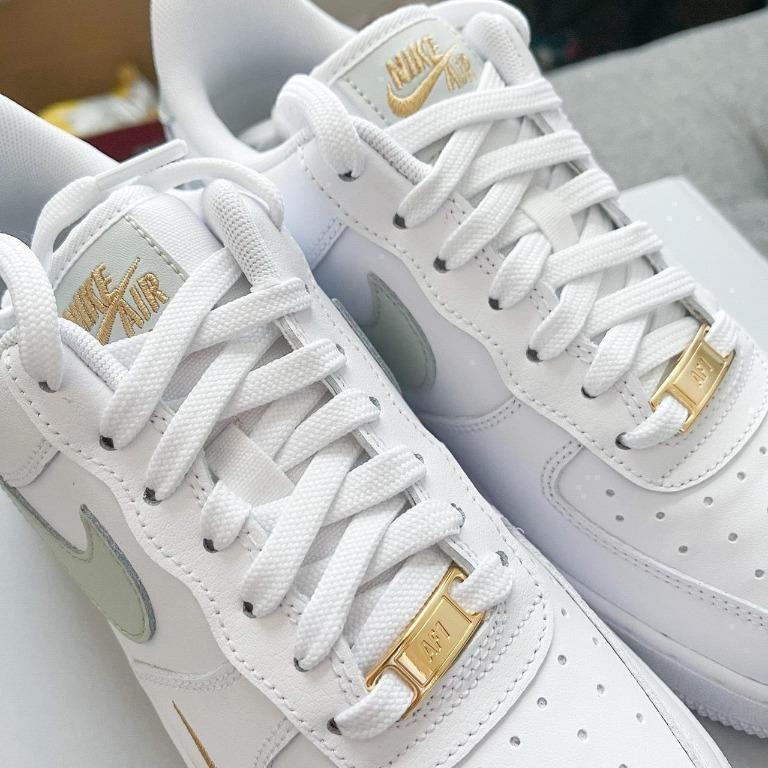 Nike white and gold hotsell shoes