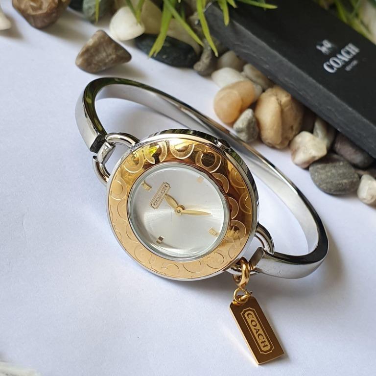 Coach Signature C Phoebe Quartz Gold Bezel Gold Dial Silver Charm Ladies Bangle Watch 14501242 Women s Fashion Watches Accessories Watches on Carousell