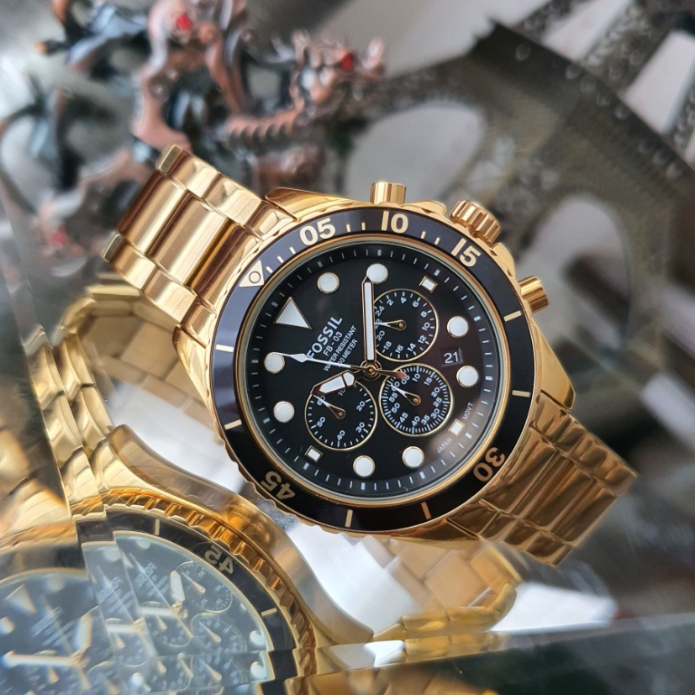 Fossil gold watch black face top