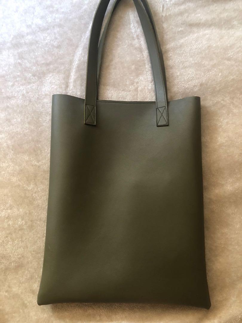 Straightforward leather bag (Category: Tote Bags) located in Manila. Submitted by shaddie (Listing ID 1139631962, Image 2). Description: Legit 💯 Tote bag or laptop bag Good as new RFS: Decluttering .