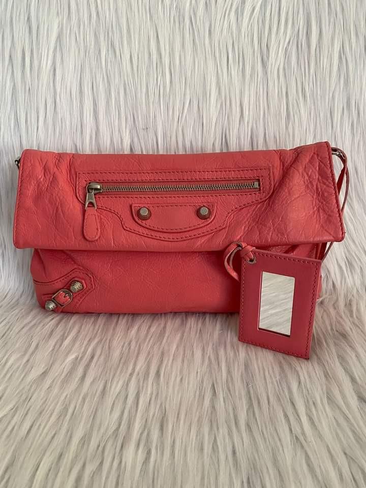 Balenciaga Envelope Clutch Strap (Category: Luxury Bags & Wallets) located in Manila. Submitted by bagislifeshop (Listing ID 1140044628, Image 2). Description: ▪️Balenciaga envelope clutch strap▪️ ☑️In transit to Manila ✅Material: Lambskin leather ✅Condition: 8.8/10 ✅Colour: Rose Hortensia in SHW ✅Inclusions: dust bag, long strap and mirror..