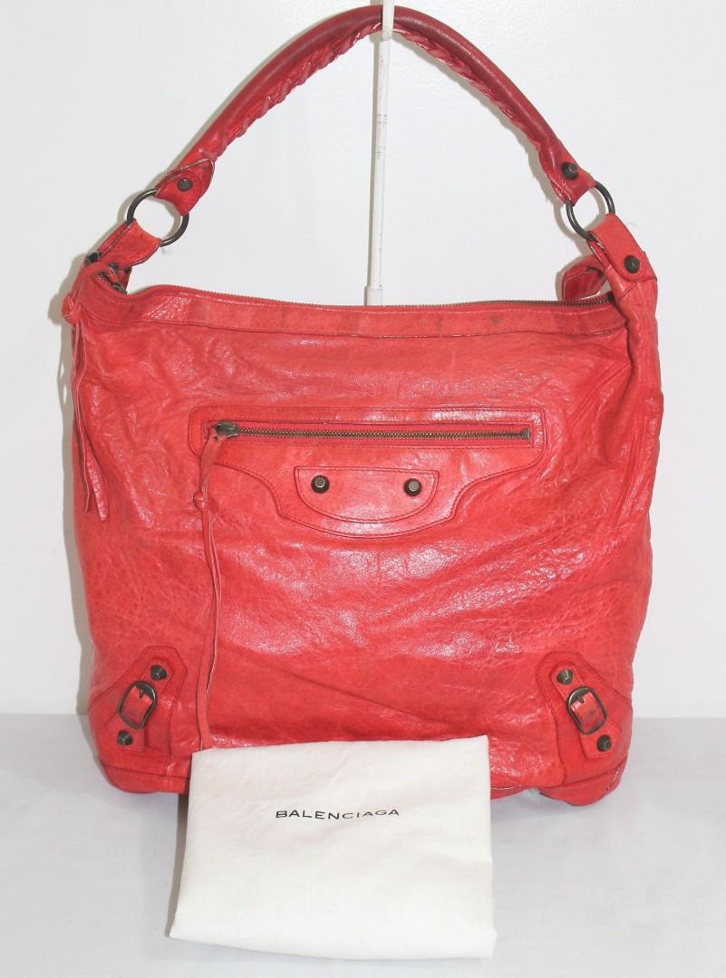 Balenciaga red shoulder bag (Category: Luxury Bags & Wallets) located in Quezon City. Submitted by theplushhaven (Listing ID 1139978841, Image 1). Description: Red Balenciaga Shoulder Day Bag pls manage your expectations signs of usage bag needs cleaning for pick up only or grab. meet up at ROBMAG.