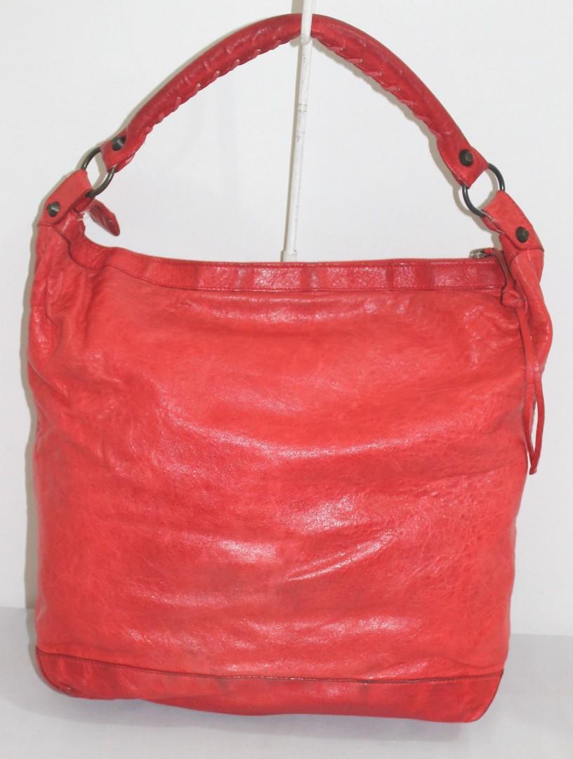 Balenciaga red shoulder bag (Category: Luxury Bags & Wallets) located in Quezon City. Submitted by theplushhaven (Listing ID 1139978841, Image 2). Description: Red Balenciaga Shoulder Day Bag pls manage your expectations signs of usage bag needs cleaning for pick up only or grab. meet up at ROBMAG.