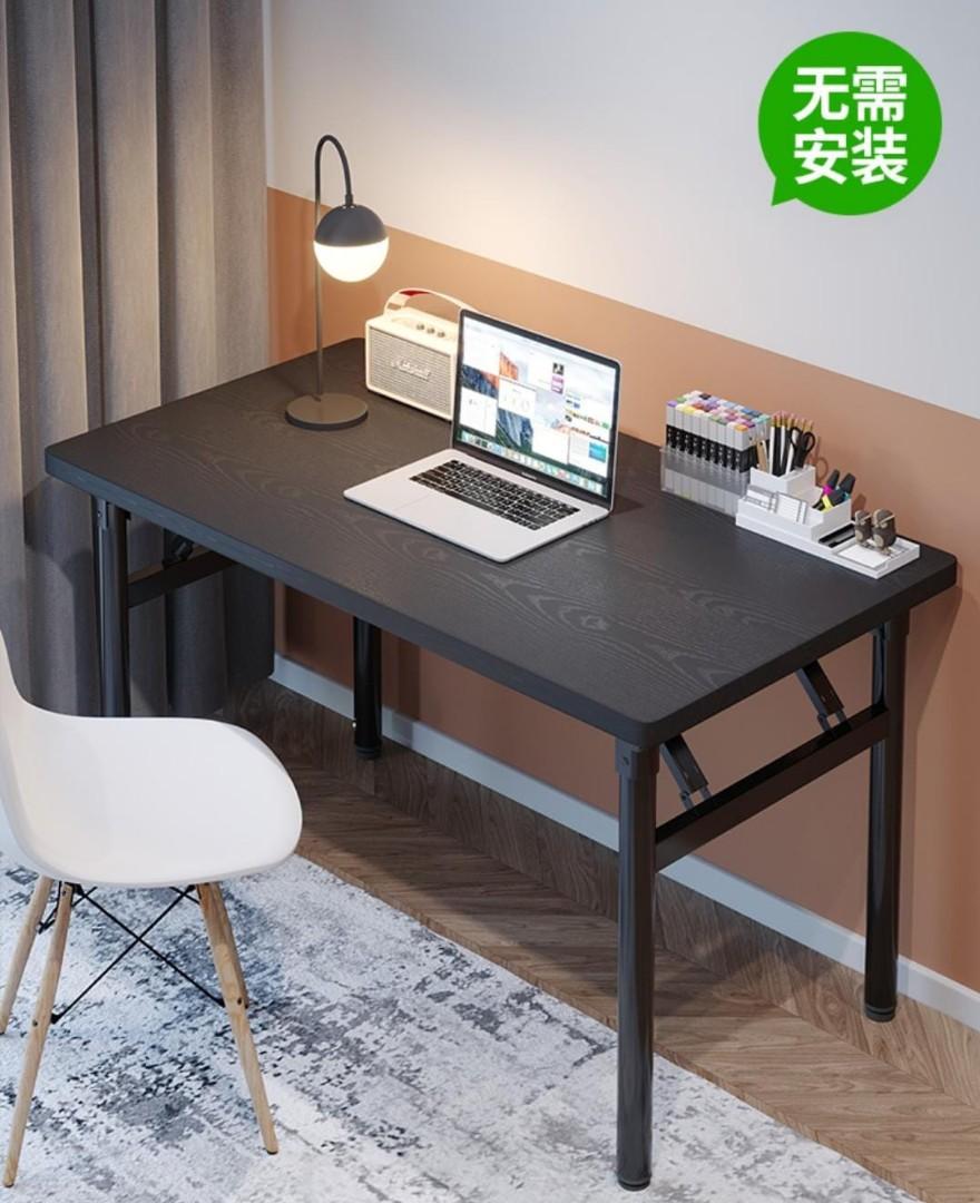 Study Table (Category: Tables & Sets) located in Singapore. Submitted by os_hsh (Listing ID 1139868556, Image 1). Description: Foldable Study Table Size : 100 x 50 x74 Colour : Black Brand new but dent due to delivery caused. Self collect Only..