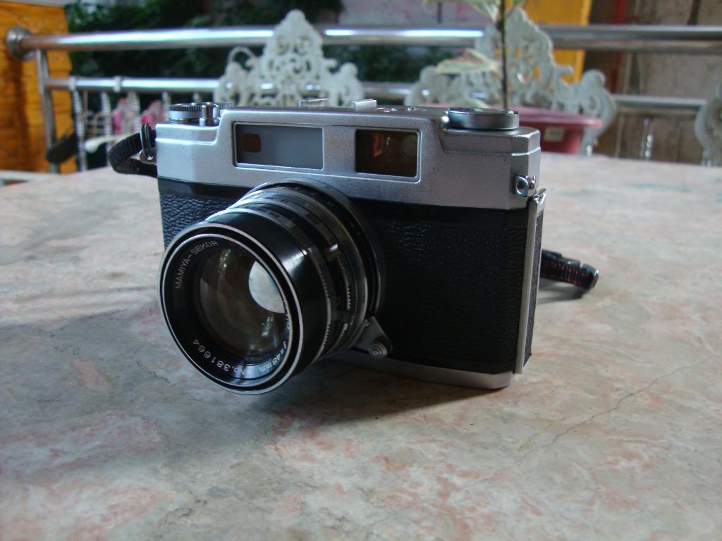 Mamiya Vintage Film Camera (Category: Cameras) located in Manila. Submitted by parokya_ni_edgar (Listing ID 1140142014, Image 2). Description: Appearance: Excellent. Condition: Good Working Condition. No Issues Film Format: 35mm/135 Made in Japan Packaged include: - Strap - Case.