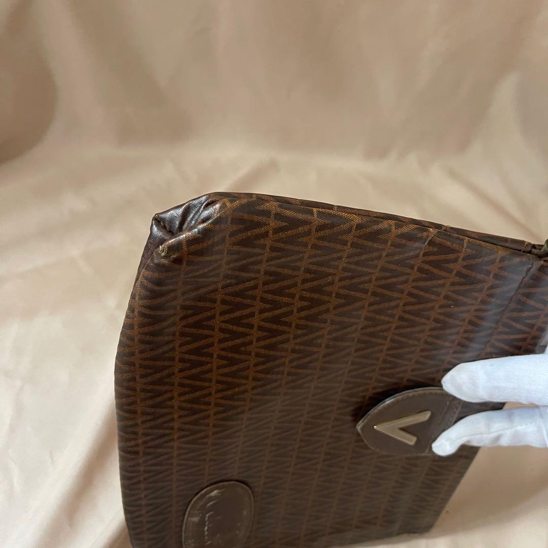 Mario Valentino brown clutch (Category: Luxury Bags & Wallets) located in Baguio. Submitted by stylehouseph (Listing ID 1140330089, Image 3). Description: 🤍 Mario Valentino Monogram brown clutch 🤍 Authentic 🤍 Flaws: Removed leather on “Valentino” label, minor rubs on bottom corners - otherwise in very good condition 🤍 ₱800 (valued at $75/ ₱3750).
