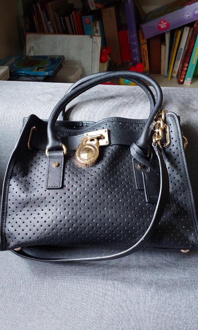 Michael Kors Perforated Hamilton bag (Category: Luxury Bags & Wallets) located in Baguio. Submitted by lotus_blossom (Listing ID 1140291698, Image 1). Description: please see posted pics working lock and key.