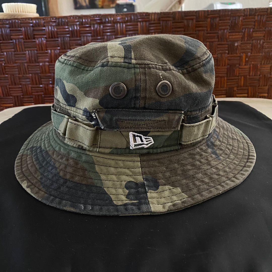 https://media.karousell.com/media/photos/products/2022/1/28/new_era_camo_bucket_hat_1643347686_cea474a9.jpg