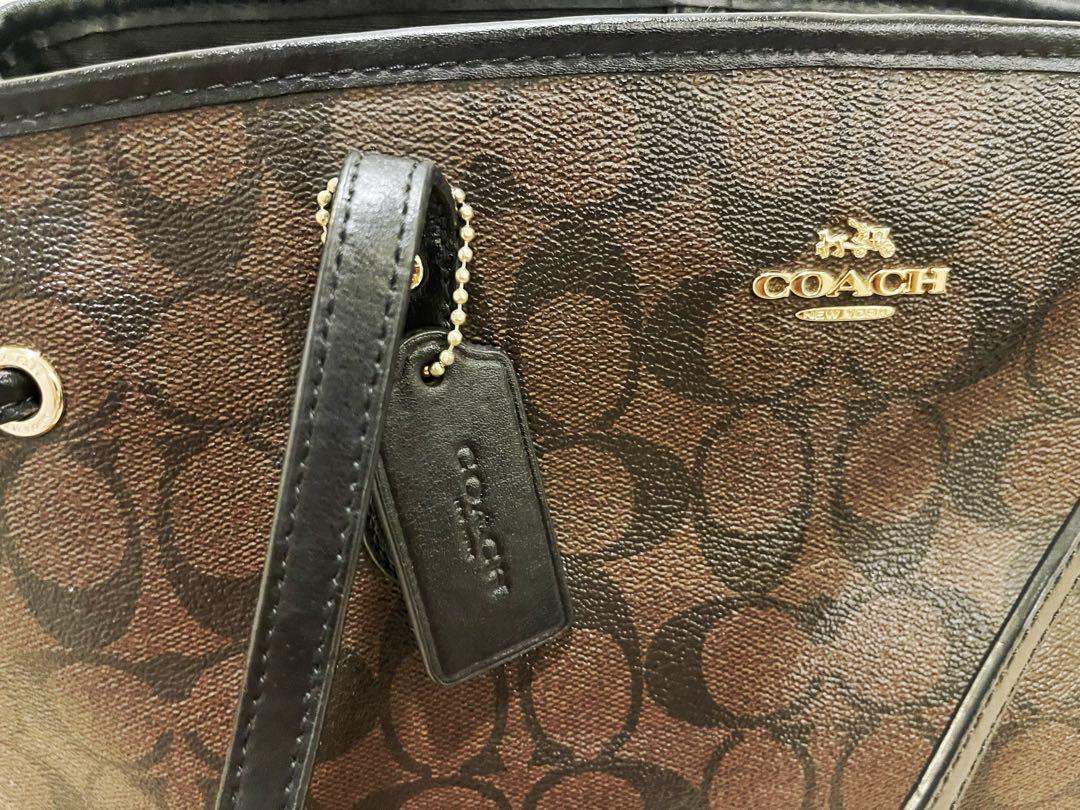 AUTHENTIC COACH DRAWSTRING CARRYALL IN SIGNATURE CANVAS (Category: Luxury Bags & Wallets) located in Quezon City. Submitted by prettyfaves (Listing ID 1140531565, Image 3). Description: ‼️FOR SALE‼️ AUTHENTIC COACH DRAWSTRING CARRYALL IN SIGNATURE CANVAS ✔️Signature coated canvas ✔️Inside zip, cell phone and multifunction pockets ✔️Center zip compartment ✔️Dogleash clip closure, fabric lining ✔️Handles with 8 1/2" drop ✔️14 1/4" (L) x 9 3/4" (H) 