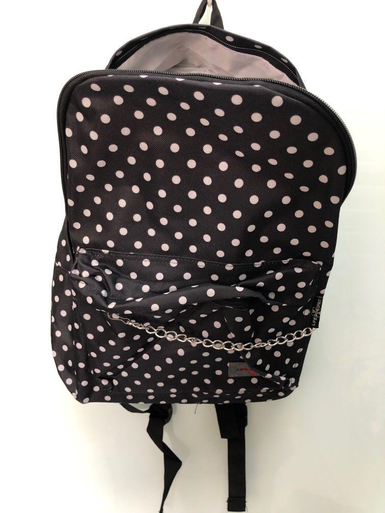 backpack (Category: Backpacks) located in Singapore. Submitted by vavecia (Listing ID 1140480062, Image 1). Description: One main compartment. With section to put smaller items (pic 3) . One front pouch with detachable chain. No side pockets for bottles. Printing error in last pic. Padded straps. Sturdy bag material. .