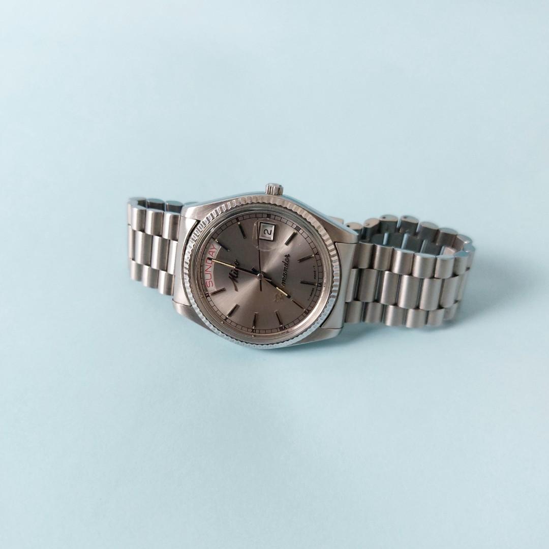 mido commander rolex