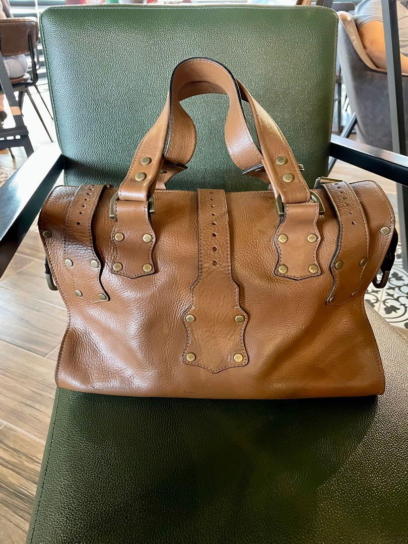 Mulberry Roxanne (Category: Luxury Bags & Wallets) located in Muntinlupa City. Submitted by phbudgetluxuryfinds (Listing ID 1135227873, Image 2). Description: Recolored by Ninani to mocha-ish brown color Interior has been repainted as well to color black With signs of use and leather aging Very durable in Darwin leather Heavy and roomy Stylish and perfect for daily errands This bag will last you a long time Brass Rivets are complete and intact .
