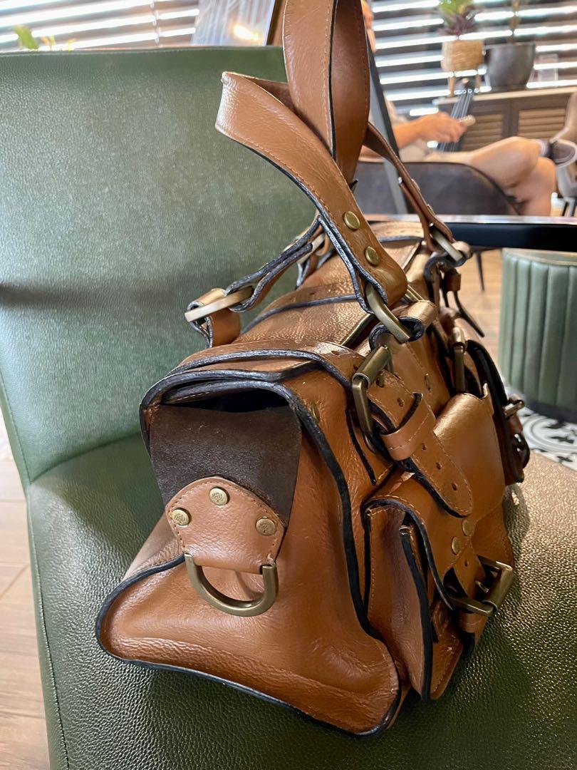 Mulberry Roxanne (Category: Luxury Bags & Wallets) located in Muntinlupa City. Submitted by phbudgetluxuryfinds (Listing ID 1135227873, Image 3). Description: Recolored by Ninani to mocha-ish brown color Interior has been repainted as well to color black With signs of use and leather aging Very durable in Darwin leather Heavy and roomy Stylish and perfect for daily errands This bag will last you a long time Brass Rivets are complete and intact .