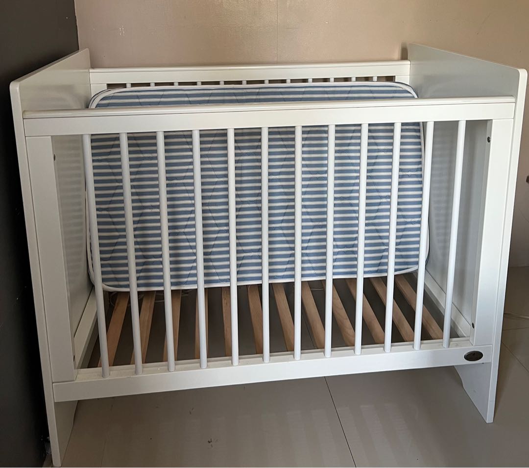 Cuddlebug white wooden crib with teething guard & mattress, Babies