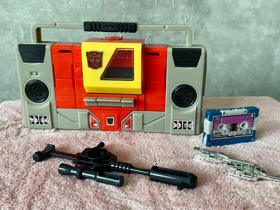 G1 Blaster & Eject Transformers (Category: Toy Figures) located in Singapore. Submitted by captainbowie (Listing ID 1140651986, Image 2). Description: Reissue G1 Blaster with Eject cassette. Includes all weapons. Both rub signs still working. Blaster spring-loaded tape door is working. Eject spring-loaded head is working, pops up and locks in as needed during transformation. No oxidation on chrome weapons yet. .