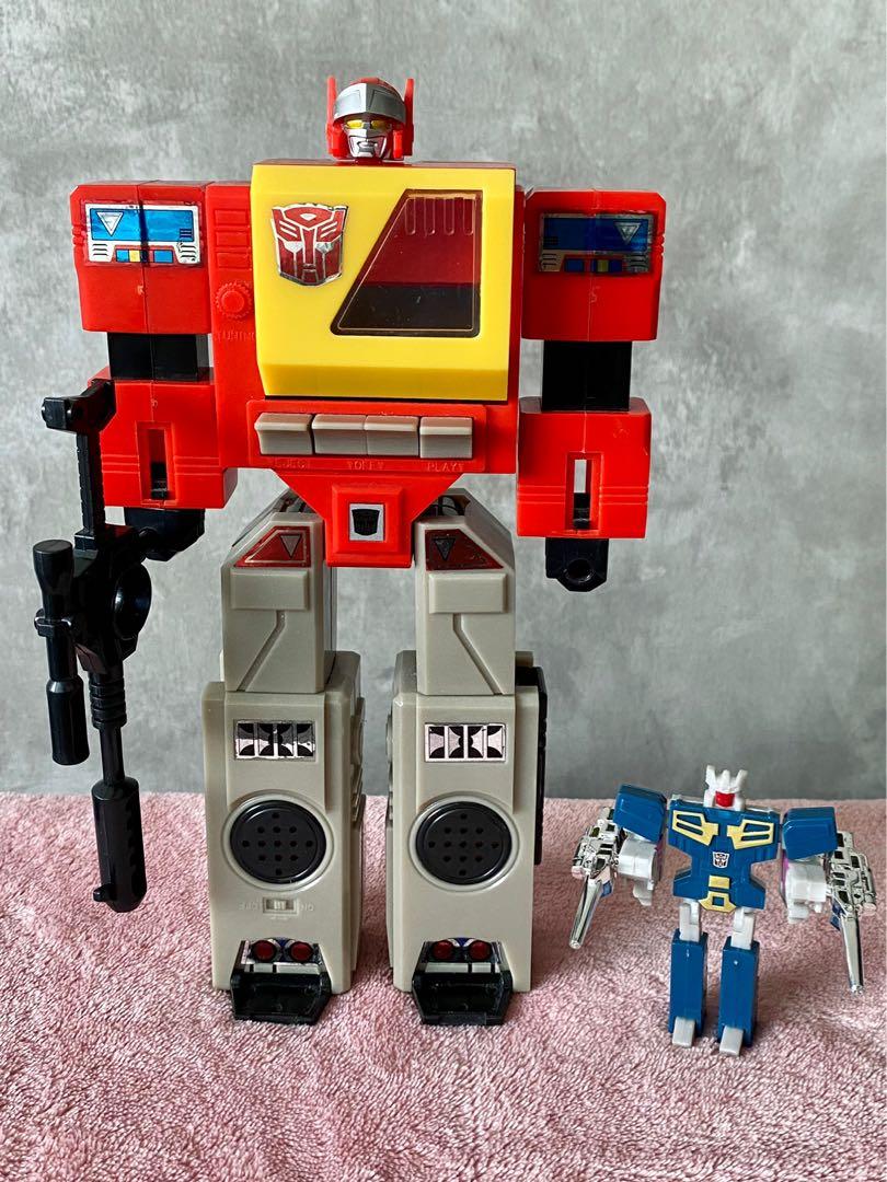 G1 Blaster & Eject Transformers (Category: Toy Figures) located in Singapore. Submitted by captainbowie (Listing ID 1140651986, Image 1). Description: Reissue G1 Blaster with Eject cassette. Includes all weapons. Both rub signs still working. Blaster spring-loaded tape door is working. Eject spring-loaded head is working, pops up and locks in as needed during transformation. No oxidation on chrome weapons yet. .