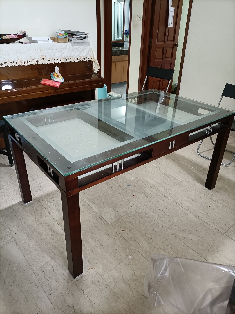 designer glass top dining table with pebbles