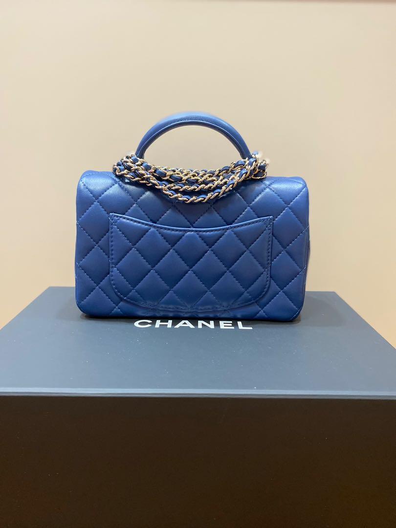 CHANEL MINI QUILTED BLUE WITH RED TRIMMINGS FLAP BAG  Still in fashion