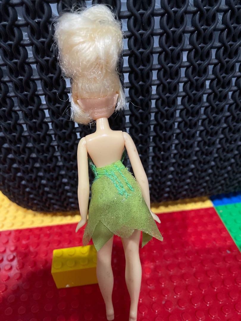 Disney Tinkerbell Doll (tiny) (Category: Figurines & Statues) located in Carmona. Submitted by thepinkplayhouse (Listing ID 1140972945, Image 3). Description: Item: Disney Tinkerbell | wearing her original clothes Size: 5.5 inches Note: Tinkerbell has no shoes in the movie. She is sold without shoes in stores. Made by Disney. Just needs minimal washing and cleaning. .