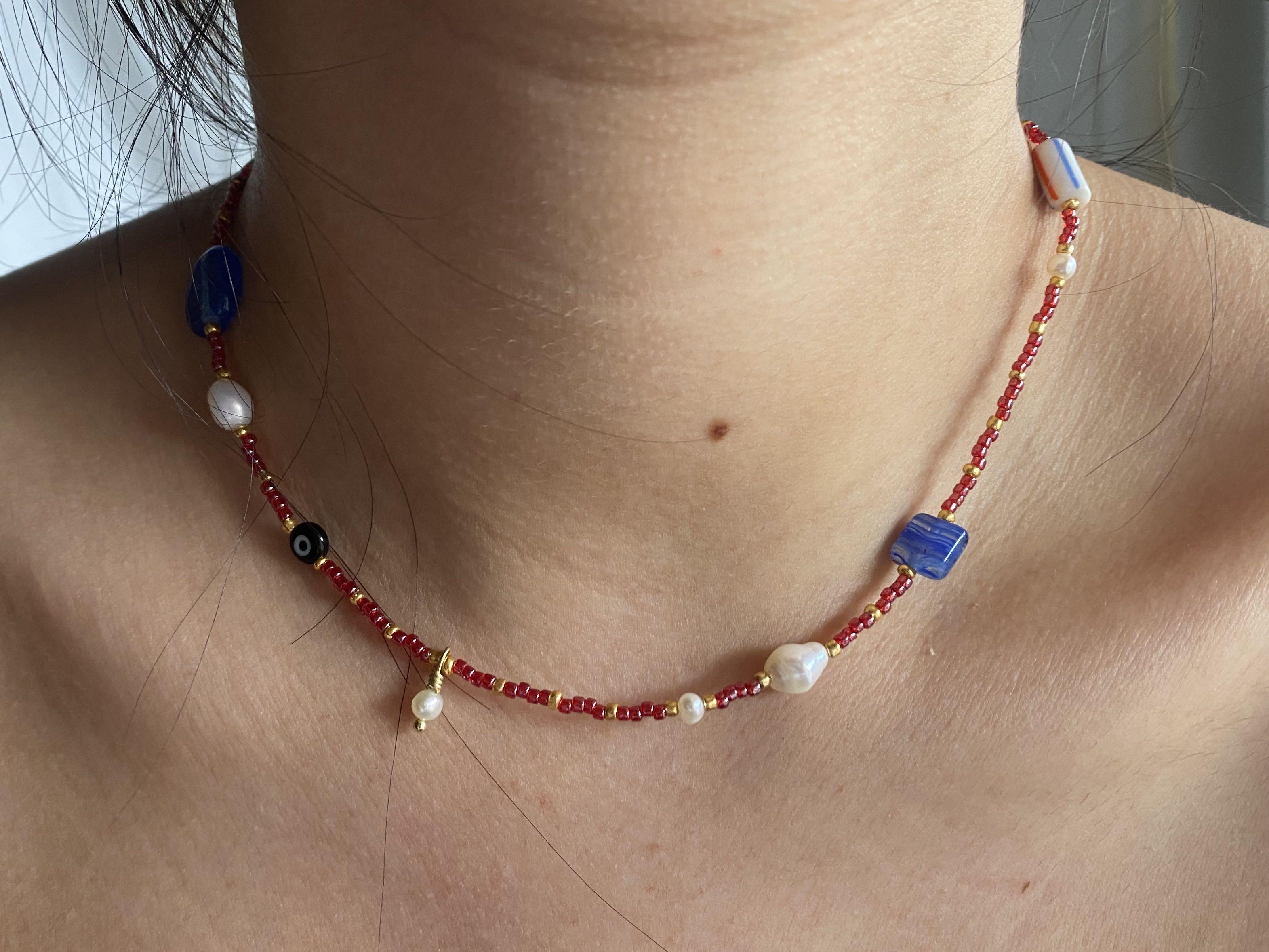 1 One of a kind red blue and gold necklace Made with y2k glass beads evil eye bead and freshwater pearls