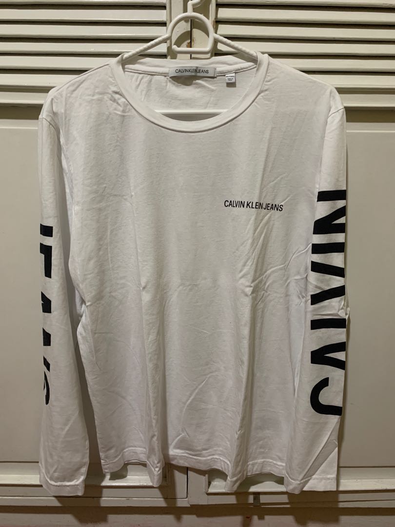 Calvin Klein Long Sleeves Graphic Tshirt (White), Men's Fashion, Tops &  Sets, Tshirts & Polo Shirts on Carousell
