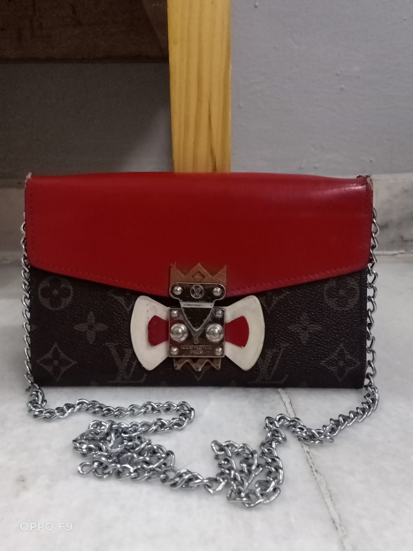 Louis Vuitton Tribal Mask Chain Wallets, Women's Fashion, Bags & Wallets,  Purses & Pouches on Carousell