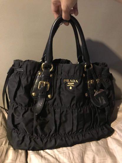 Prada Bag (Category: Luxury Bags & Wallets) located in Makati City. Submitted by decluttermakati (Listing ID 1135623218, Image 1). Description: Width is 15 CM Height is 23 CM Length is 37 CM.