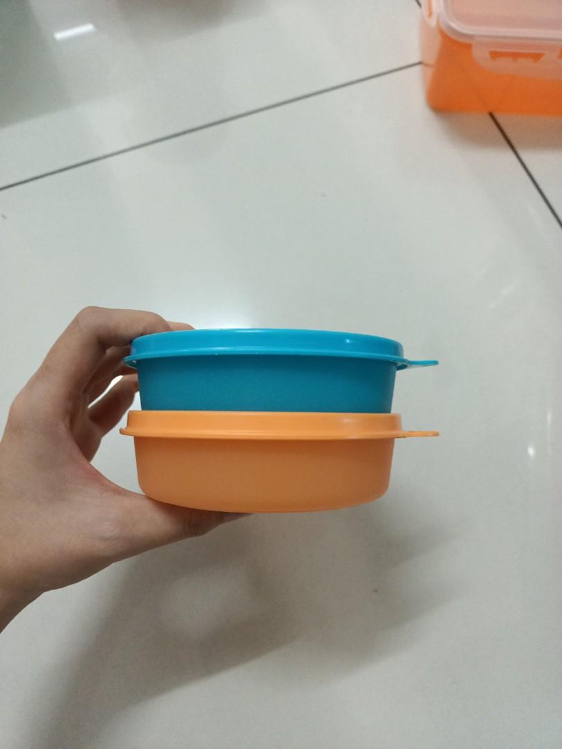 Tupperware container (Category: Food Organisation & Storage) located in Butterworth. Submitted by jsprelovedb (Listing ID 1135892522, Image 3). Description: 1. Long (Blue/green RESERVED/pink RESERVED) RM10 each 2. Small round (blue/orange) RM6 each 3. Transparent round RM7 SOLD 4. Yellow medium size RM7 SOLD Yellow big size RM9 5. Round (purple/pink x2) RM7 each SOLD 6. Flat RM6 SOLD Medium (purple x2) RM9 each Large RM10 SOLD.