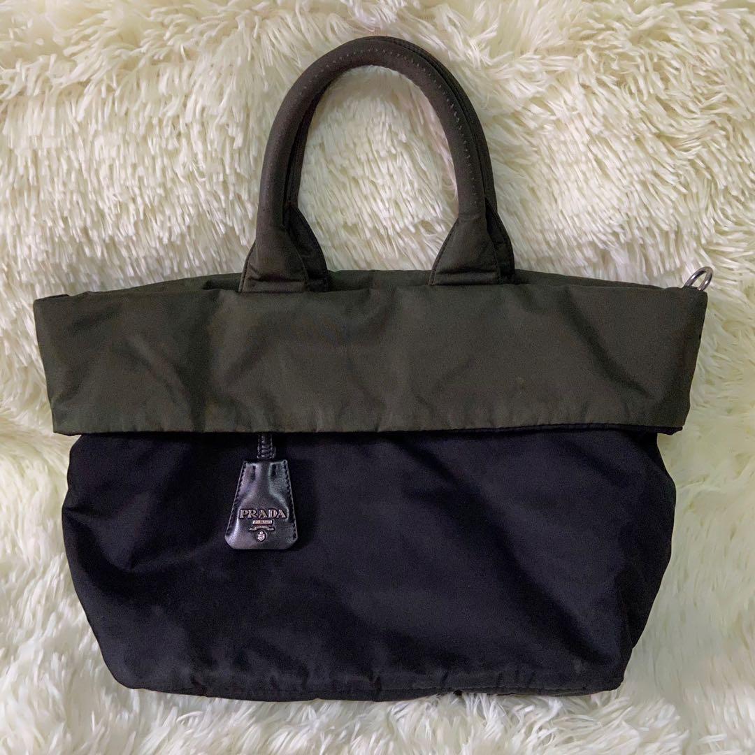 Prada Tessuto Reversible Tote Bag (Category: Luxury Bags & Wallets) located in Las Pinas. Submitted by Le.Pattie.Luxe (Listing ID 1136012174, Image 2). Description: Authentic Small Prada Tessuto Reversible Tote Bag 🖤Php 12,000🖤 Colors: black & army green Reversible to slightly discolored army green With Prada bag charm, 2 zip pockets & Prada metal triangle logo on the side With d-rings for strap No inclusion Approx size: 11-16 x 9.5 x 7in (LxHx