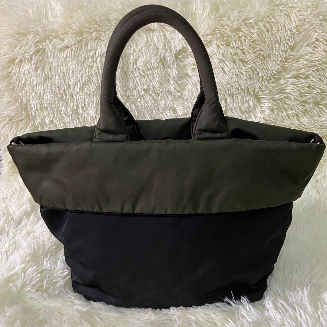 Prada Tessuto Reversible Tote Bag (Category: Luxury Bags & Wallets) located in Las Pinas. Submitted by Le.Pattie.Luxe (Listing ID 1136012174, Image 3). Description: Authentic Small Prada Tessuto Reversible Tote Bag 🖤Php 12,000🖤 Colors: black & army green Reversible to slightly discolored army green With Prada bag charm, 2 zip pockets & Prada metal triangle logo on the side With d-rings for strap No inclusion Approx size: 11-16 x 9.5 x 7in (LxHx