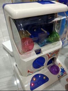 Vintage capsules machines, gashapon coin in and rotate for toys gl