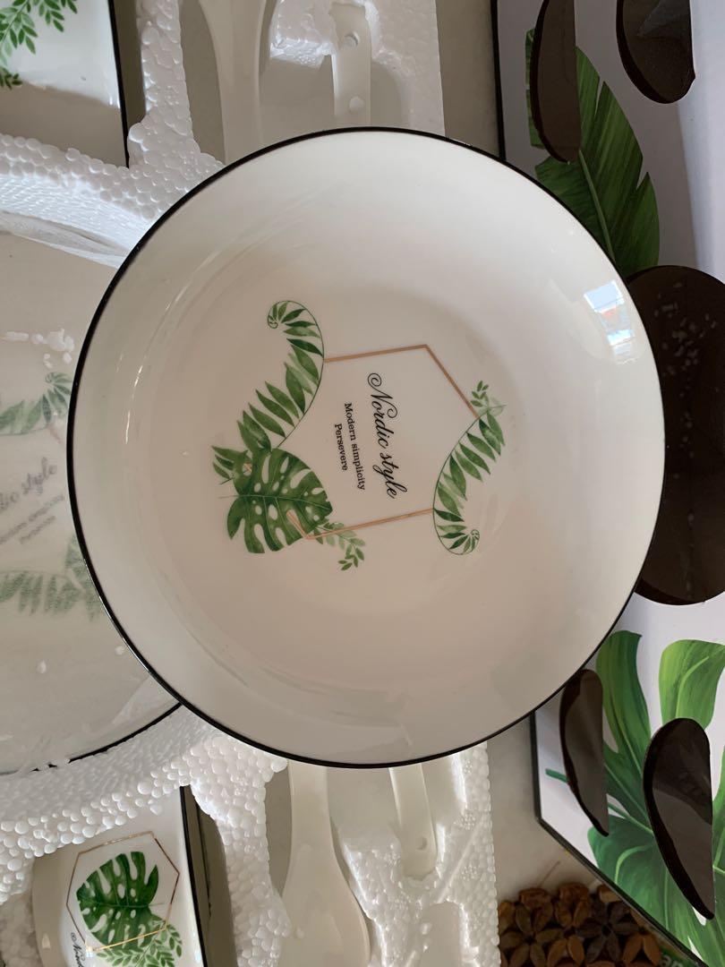Ceramic tableware set (Category: Dinnerware & Cutlery) located in Singapore. Submitted by pink_lemon (Listing ID 1136228150, Image 3). Description: Very beautiful ceramic. Set consists: 4 bowls 4 spoons 2 8” dish Mint condition. Never used..
