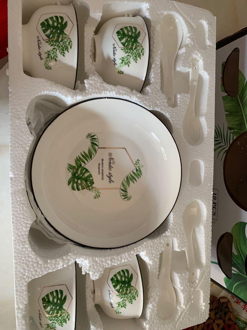 Ceramic tableware set (Category: Dinnerware & Cutlery) located in Singapore. Submitted by pink_lemon (Listing ID 1136228150, Image 2). Description: Very beautiful ceramic. Set consists: 4 bowls 4 spoons 2 8” dish Mint condition. Never used..