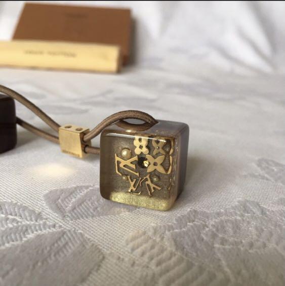 Used authentic vintage Louis Vuitton cube hair tie, Luxury, Accessories on  Carousell