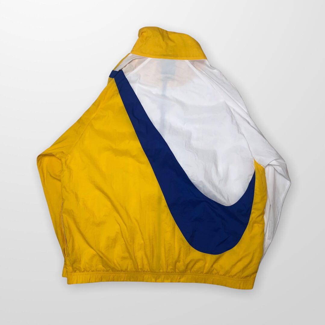 Nike big sales swoosh jacket yellow