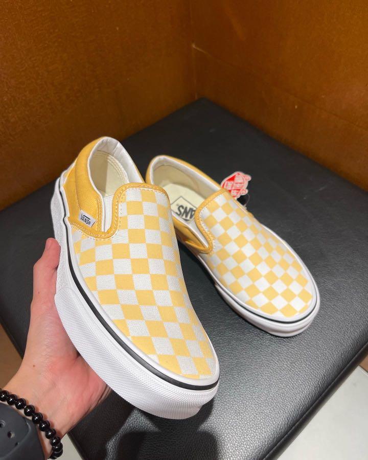 Checkerboard vans slip shop on yellow