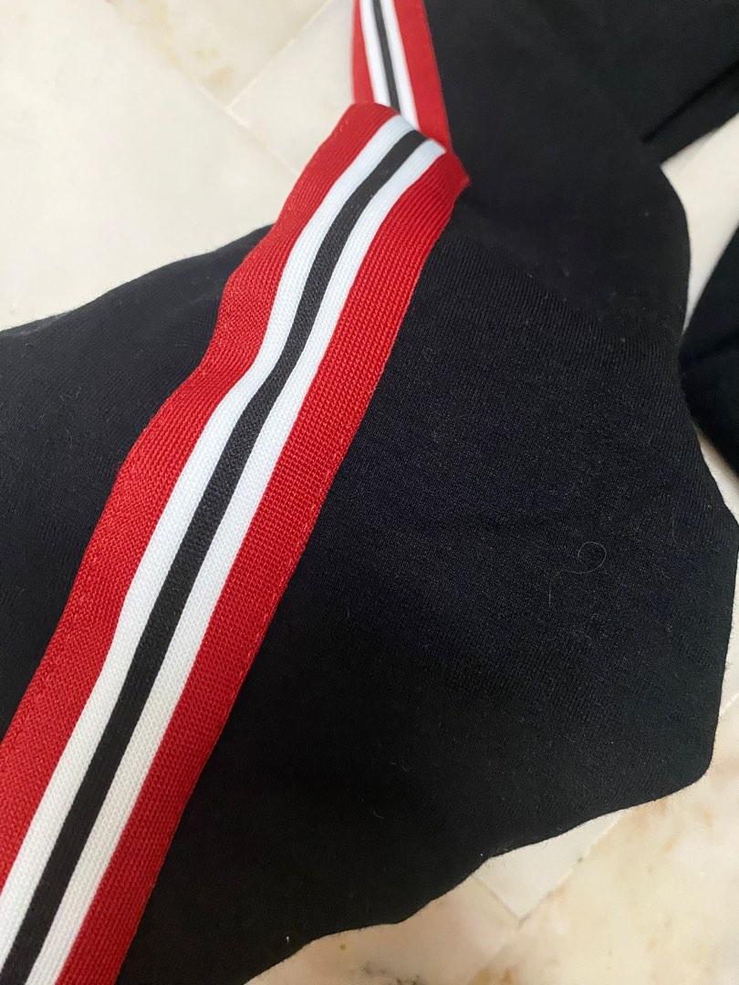 Black jumpsuit with red stripe sales
