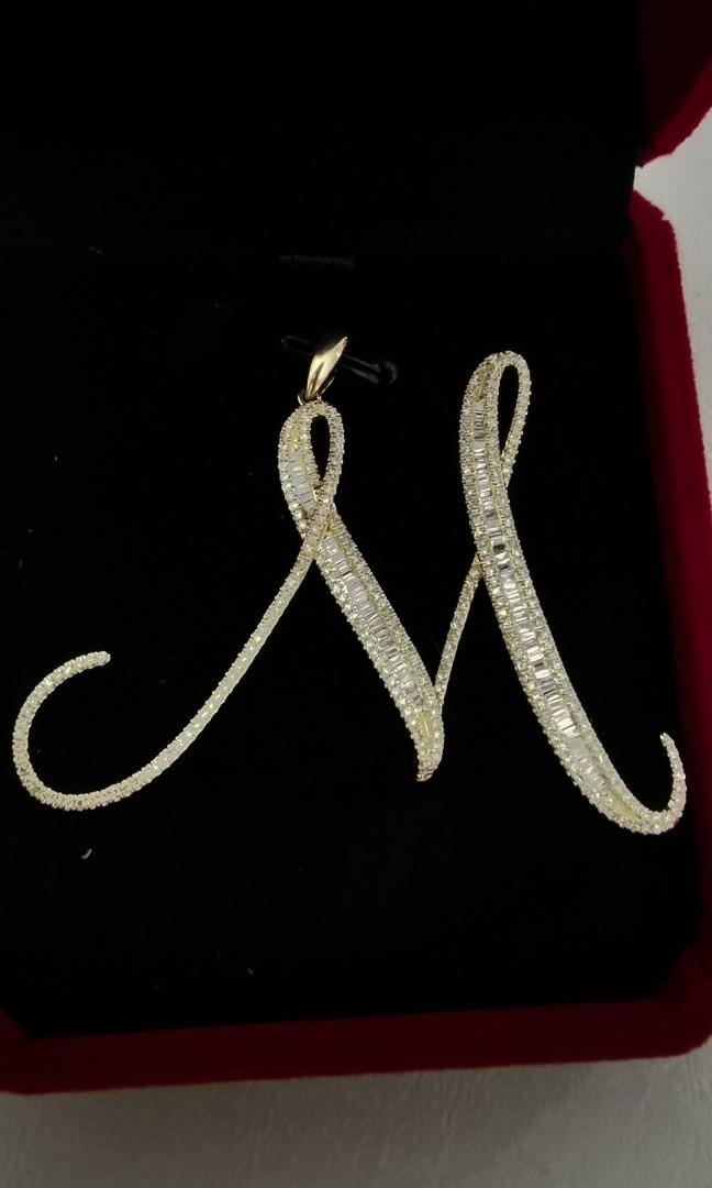 14K Customized M Initial Pendant with Diamonds (Category: Necklaces) located in Las Pinas. Submitted by oochiecoochie (Listing ID 1189771892, Image 3). Description: - 14 karat yellow gold - natural mined round&baguette diamonds - pawnable - 2.1 inch height from bottom to bale - 6.05 grams This is a made to order pendant which i ordered from a bulacan jeweler in 2021 at ₱50,000 but i never had the chance to wear this and was just kept inside my je