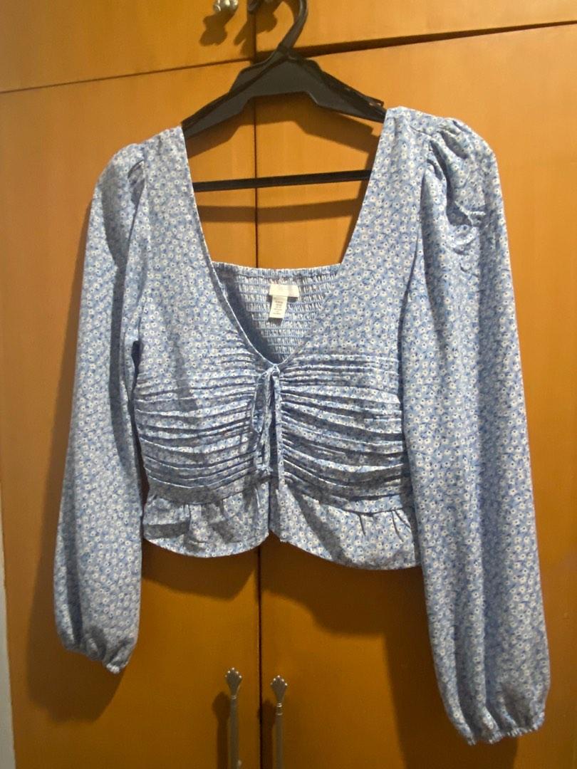 H&M Light Blue Ruched Long Sleeve Top (Category: Blouses) located in Pasig City. Submitted by preloveddd_ds (Listing ID 1189908482, Image 1). Description: Bought for 999 NEVER USED Fits US 2-4 comfortably Super flattering on but no longer my style Helping tags Floral Cottage core Dainty top Ruffles Ruche H&M Crop top Classy Girly .