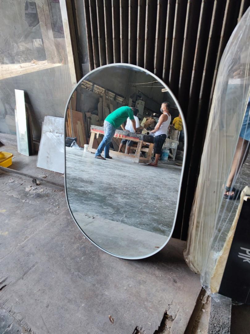 Oval mirror with frame (Category: Mirrors) located in Malabon City. Submitted by mirrors.ph (Listing ID 1189790725, Image 2). Description: Oval mirror with white aluminum frame and plywood backing. Using 6mm thick copper free lead free mirror. Size: 2ft x 3ft P1620 Add P100 if with back hook. Available colors gold, glossy black, matte black, white and silver aluminum frame. Customize sizes and shapes are welcome..