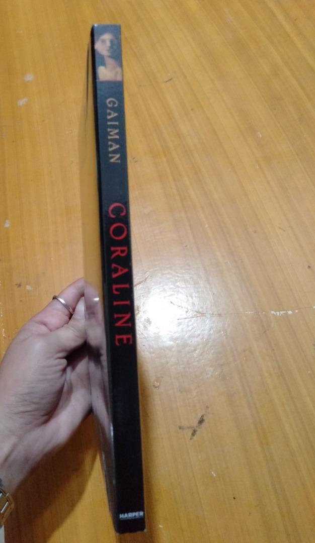 Coraline by Neil Gaiman (Category: Storybooks) located in Manila. Submitted by brokerbeatrice (Listing ID 1190115659, Image 3). Description: This edition of New York Times bestselling and Newbery Medal-winning author Neil Gaiman’s modern classic, Coraline—also an Academy Award-nominated film—is enriched with a foreword from the author, a reader's guide, and more. This middle grade novel is an excellent choice for tween readers in grades 5 to 6, e