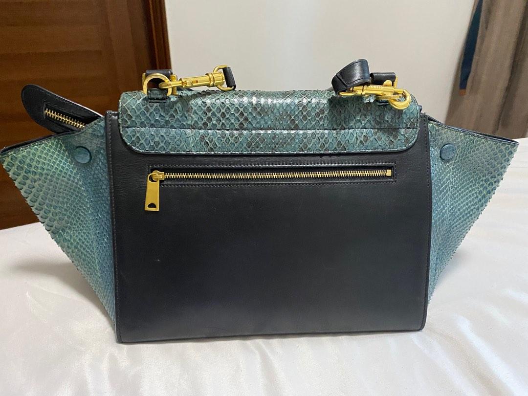 Celine Trapèze python handbag (Category: Bags & Wallets) located in Singapore. Submitted by jinglingbell (Listing ID 1190130974, Image 3). Description: Classic navy blue, python skin Celine trapeze calf leather bag, well maintained, light scratches. Shoulder strap included. .