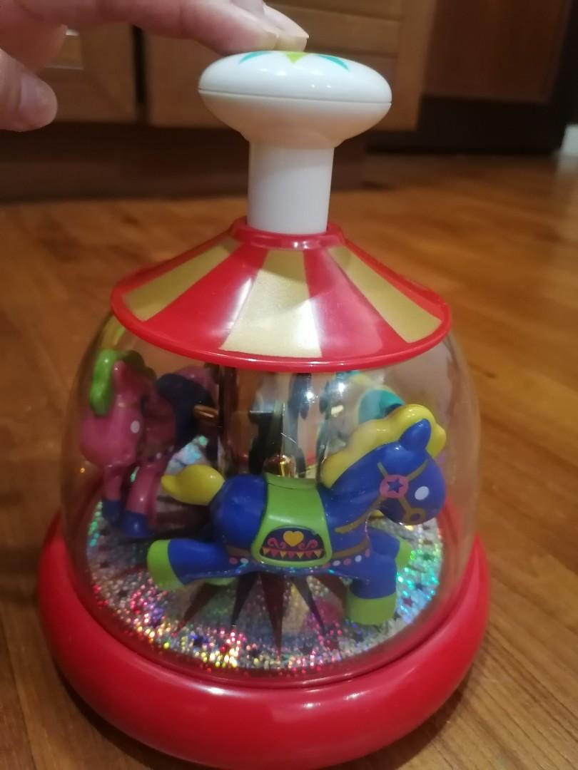 Push and spin carousel hot sale