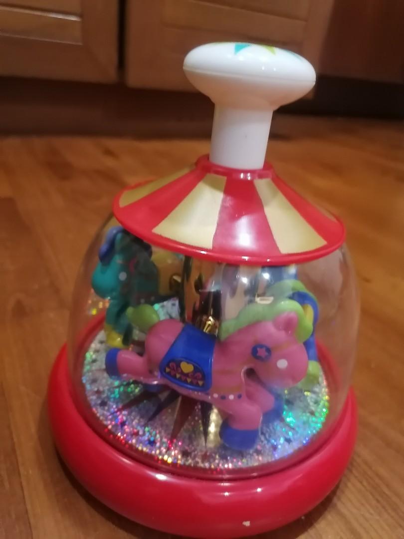 Push and spin carousel hotsell